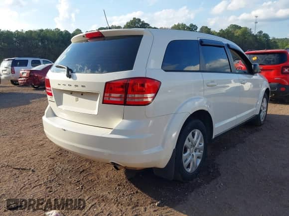 2014 Dodge Journey SE with VIN 3C4PDCABXET214038, listed as a IAAI auction lot 43390602 with 155,052 mi miles and . Bid and sale history available at DreamBid. Image 4.