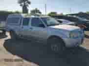 2004 Nissan Frontier XE with VIN 1N6ED29X24C429616, listed as a Copart auction lot 57605075 with 214,815 mi miles and Salvage title. Bid and sale history available at DreamBid. Image 4.