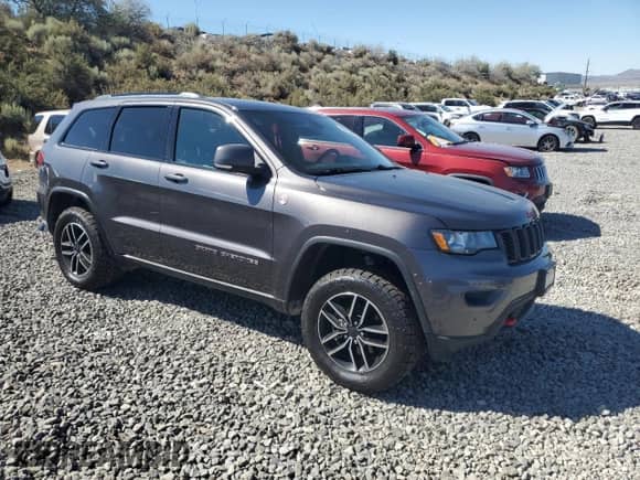 2019 Jeep Grand Cherokee Trailhawk with VIN 1C4RJFLG0KC553944, listed as a Copart auction lot 68022805 with 103,477 mi miles and Salvage title. Bid and sale history available at DreamBid. Image 4.