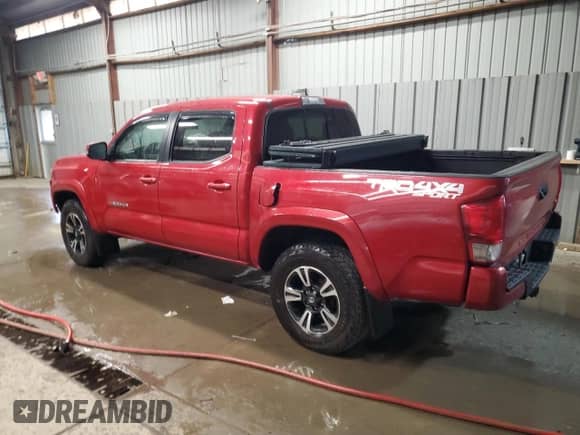 2017 Toyota Tacoma SR5 with VIN 5TFCZ5AN7HX093726, listed as a Copart auction lot 82410365 with 76,422 mi miles and Salvage title. Bid and sale history available at DreamBid. Image 2.