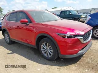 2022 Mazda CX-5 S Carbon Edition z VIN JM3KFBCM5N1550451, wystawiony jako IAAI lot #42779598 z przebiegiem 63 875 mil mil oraz . Historia ofert i sprzedaży dostępna na DreamBid. Obrazek 1.