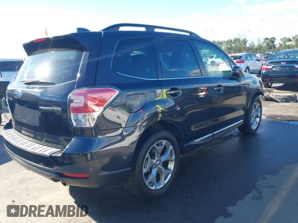 2018 Subaru Forester Touring z VIN JF2SJAWC6JH455890, wystawiony jako IAAI lot #43426177 z przebiegiem 44 143 mil mil oraz . Historia ofert i sprzedaży dostępna na DreamBid. Obrazek 4.