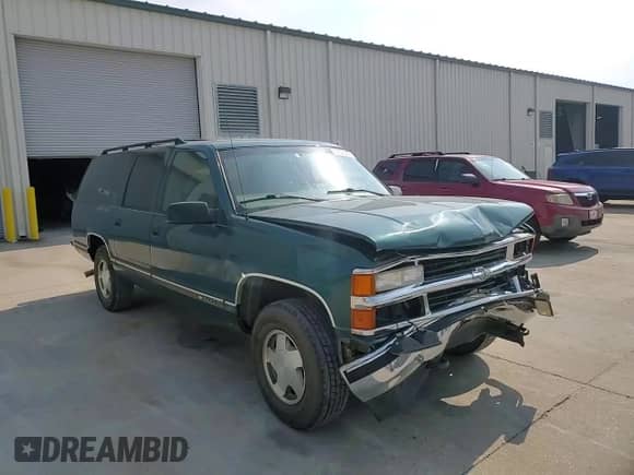 1997 Chevrolet Suburban with VIN 3GNFK16RXVG114579, listed as a Copart auction lot 57333295 with 117,040 mi miles and Salvage title. Bid and sale history available at DreamBid. Image 14.