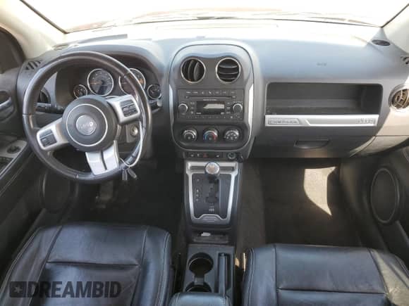 2015 Jeep Compass Latitude with VIN 1C4NJCEB5FD397611, listed as a Copart auction lot 57149015 with 130,292 mi miles and Salvage title. Bid and sale history available at DreamBid. Image 8.