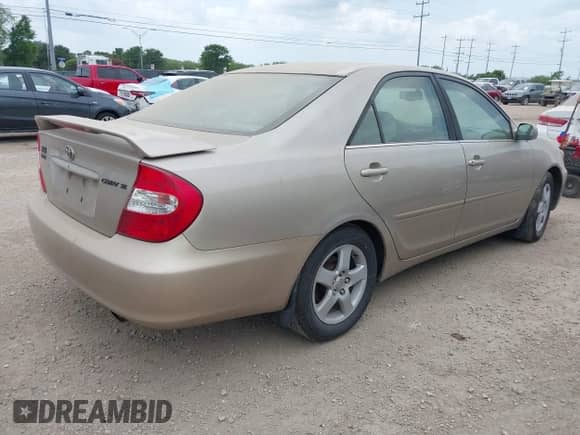 2002 Toyota Camry LE z VIN 4T1BE32K52U614799, wystawiony jako IAAI lot #42422888 z przebiegiem 192 893 mil mil oraz . Historia ofert i sprzedaży dostępna na DreamBid. Obrazek 4.
