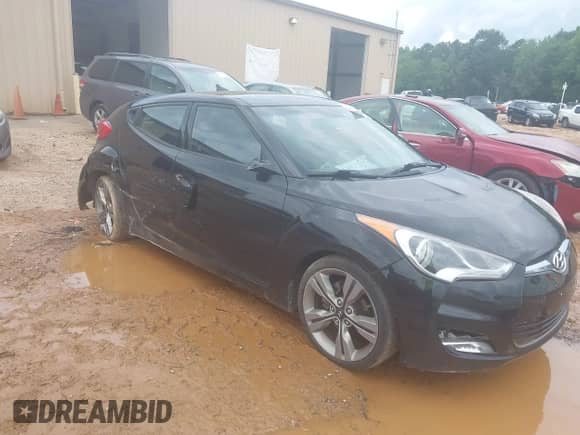 2012 Hyundai Veloster w/Red Int z VIN KMHTC6AD0CU076528, wystawiony jako IAAI lot #42651736 z przebiegiem 117 125 mil mil oraz . Historia ofert i sprzedaży dostępna na DreamBid. Obrazek 1.