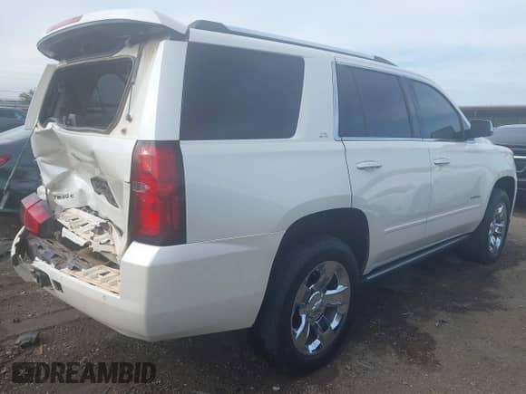 2015 Chevrolet Tahoe LTZ z VIN 1GNSKCKC1FR690803, wystawiony jako IAAI lot #43335116 z przebiegiem 223 442 mil mil oraz . Historia ofert i sprzedaży dostępna na DreamBid. Obrazek 4.