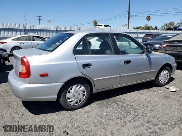 2002 Hyundai Accent GL с VIN KMHCG45C92U353198, выставлен на аукционе Copart как лот 68305654 с пробегом 130 594 миль миль и Чистый • Clean title. История ставок и продаж доступна на DreamBid. Изображение 3.