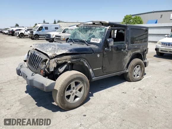 2011 Jeep Wrangler Rubicon with VIN 1J4HA6D17BL574211, listed as a Copart auction lot 64483405 with 95,777 mi miles and Salvage title. Bid and sale history available at DreamBid. Image 1.