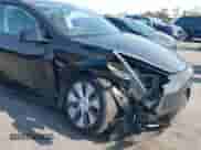 2023 Tesla Model Y Long Range z VIN 7SAYGAEE9PF851348, wystawiony jako IAAI lot #43167064 z przebiegiem Nie podano mil oraz . Historia ofert i sprzedaży dostępna na DreamBid. Obrazek 6.