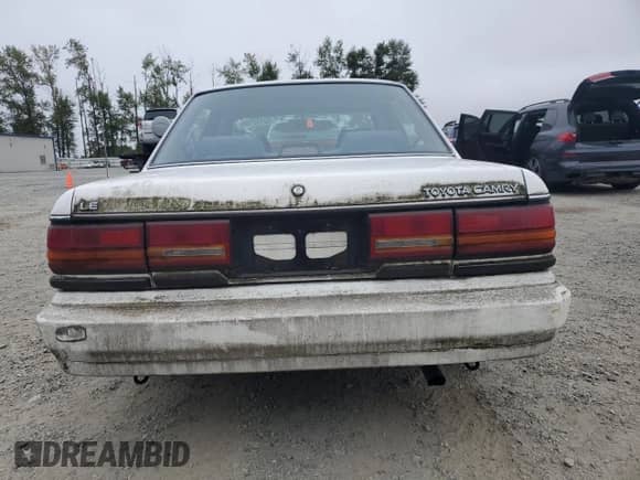 1990 Toyota Camry с VIN 4T1SV22E6LU267277, выставлен на аукционе Copart как лот 80152155 с пробегом 116 056 миль миль и Списание • Salvage title. История ставок и продаж доступна на DreamBid. Изображение 6.