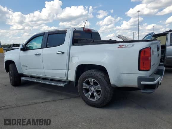 2016 Chevrolet Colorado 4WD Z71 with VIN 1GCGTDE32G1280489, listed as a Copart auction lot 71402225 with 128,964 mi miles and Salvage title. Bid and sale history available at DreamBid. Image 2.