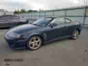 2005 Hyundai Tiburon GT с VIN KMHHN65F95U159244, выставлен на аукционе Copart как лот 76318134 с пробегом 78 324 миль миль и Чистый • Clean title. История ставок и продаж доступна на DreamBid. Изображение 1.