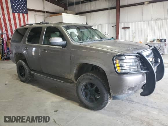 2011 Chevrolet Tahoe LT with VIN 1GNSKBE02BR317176, listed as a Copart auction lot 59671175 with 180,216 mi miles and Salvage title. Bid and sale history available at DreamBid. Image 4.