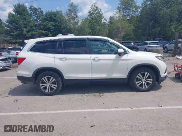 2017 Honda Pilot EX-L with VIN 5FNYF6H77HB017722, listed as a IAAI auction lot 42800151 with 94,457 mi miles and . Bid and sale history available at DreamBid. Image 13.