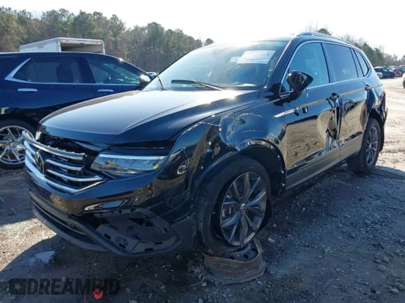 2023 Volkswagen Tiguan SE with VIN 3VVMB7AX7PM032629, listed as a IAAI auction lot 41441468 with 52,518 mi miles and . Bid and sale history available at DreamBid. Image 2.