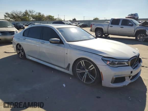 2017 BMW 7 Series with VIN WBA7H6C30HG614434, listed as a Copart auction lot 79236714 with Not provided miles and Clean title. Bid and sale history available at DreamBid. Image 4.