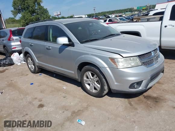 2012 Dodge Journey SXT z VIN 3C4PDCBBXCT354070, wystawiony jako IAAI lot #43211177 z przebiegiem 195 840 mil mil oraz . Historia ofert i sprzedaży dostępna na DreamBid. Obrazek 1.