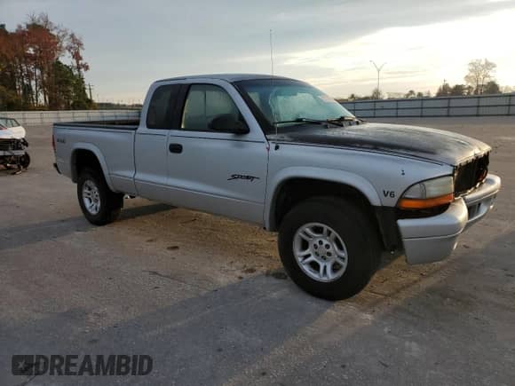 2001 Dodge Dakota z VIN 1B7GG22X71S348268, wystawiony jako Copart lot #82101434 z przebiegiem 267 004 mil mil oraz Szkoda całkowita • Salvage title. Historia ofert i sprzedaży dostępna na DreamBid. Obrazek 4.