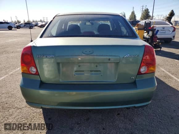 2003 Hyundai Accent GL с VIN KMHCG45C63U430403, выставлен на аукционе Copart как лот 86430724 с пробегом 74 200 миль миль и Списание • Salvage title. История ставок и продаж доступна на DreamBid. Изображение 6.