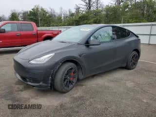 2022 Tesla Model Y Long Range с VIN 7SAYGDEE8NF417629, выставлен на аукционе Copart как лот 80784435 с пробегом 56 914 миль миль и Списание • Salvage title. История ставок и продаж доступна на DreamBid. Изображение 1.