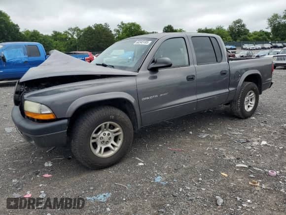2002 Dodge Dakota Sport z VIN 1B7HL38N52S719442, wystawiony jako Copart lot #60345185 z przebiegiem 176 022 mil mil oraz Szkoda całkowita • Salvage title. Historia ofert i sprzedaży dostępna na DreamBid. Obrazek 1.