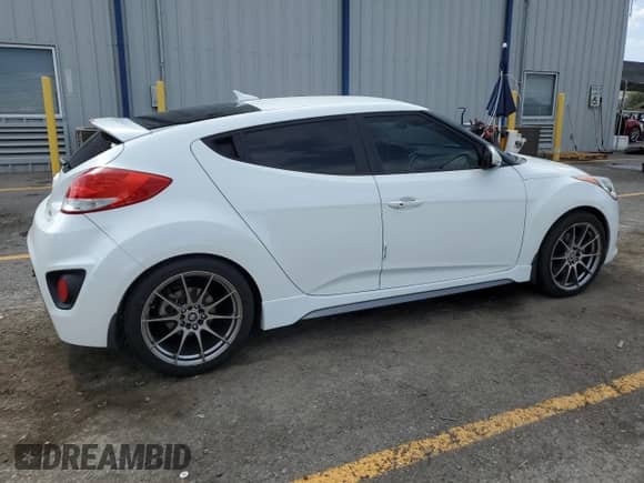 2014 Hyundai Veloster Turbo R-Spec с VIN KMHTC6AE1EU208532, выставлен на аукционе Copart как лот 70159995 с пробегом 75 844 миль миль и Списание • Salvage title. История ставок и продаж доступна на DreamBid. Изображение 3.