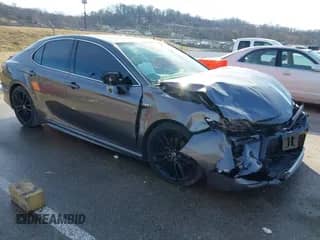 2021 Toyota Camry Hybrid XSE with VIN 4T1K31AK2MU023604, listed as a IAAI auction lot 41476057 with 26,211 mi miles and . Bid and sale history available at DreamBid. Image 1.