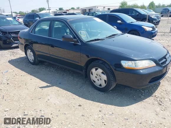 1999 Honda Accord LX with VIN 1HGCG164XXA057711, listed as a IAAI auction lot 42415923 with 166,534 mi miles and . Bid and sale history available at DreamBid. Image 1.