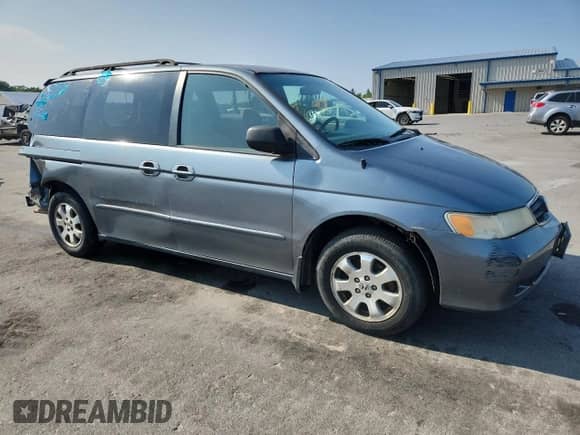 2002 Honda Odyssey LX with VIN 2HKRL18532H504584, listed as a Copart auction lot 67735975 with 230,708 mi miles and Salvage title. Bid and sale history available at DreamBid. Image 4.