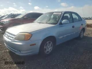 2005 Hyundai Accent GLS z VIN KMHCG45C55U672103, wystawiony jako Copart lot #67539055 z przebiegiem 134 984 mil mil oraz Szkoda całkowita • Salvage title. Historia ofert i sprzedaży dostępna na DreamBid. Obrazek 1.