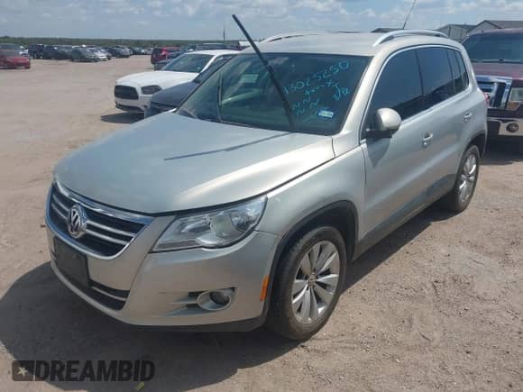 2011 Volkswagen Tiguan S with VIN WVGAV7AX1BW555710, listed as a IAAI auction lot 43025250 with 174,370 mi miles and . Bid and sale history available at DreamBid. Image 2.
