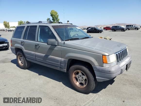 1996 Jeep Grand Cherokee Laredo z VIN 1J4GZ58Y4TC329759, wystawiony jako Copart lot #64148295 z przebiegiem 176 866 mil mil oraz Szkoda całkowita • Salvage title. Historia ofert i sprzedaży dostępna na DreamBid. Obrazek 4.