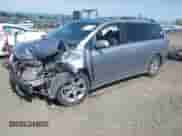 2012 Toyota Sienna SE with VIN 5TDXK3DC7CS258273, listed as a IAAI auction lot 42444615 with Not provided miles and . Bid and sale history available at DreamBid. Image 2.