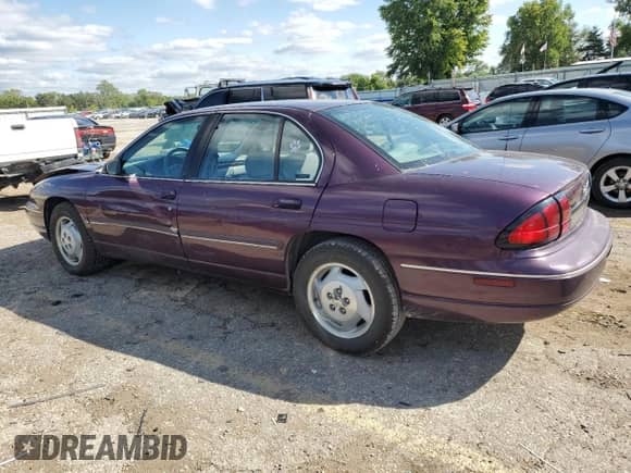 1997 Chevrolet Lumina with VIN 2G1WL52M0V9135340, listed as a Copart auction lot 72818014 with 71,699 mi miles and Salvage title. Bid and sale history available at DreamBid. Image 2.