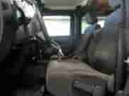 2012 Jeep Wrangler Sport with VIN 1C4AJWAG4CL215593, listed as a Copart auction lot 71013325 with 112,333 mi miles and Salvage title. Bid and sale history available at DreamBid. Image 7.