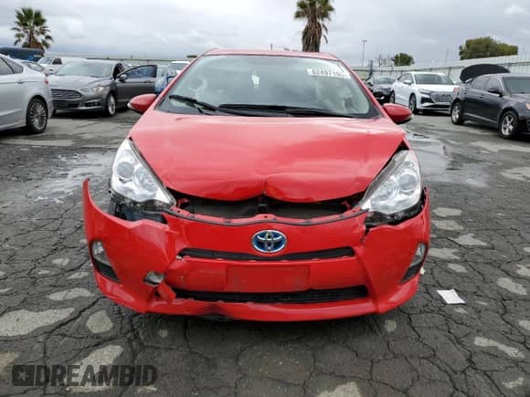 2014 Toyota Prius One z VIN JTDKDTB34E1569568, wystawiony jako Copart lot #82497155 z przebiegiem Nie podano mil oraz Szkoda całkowita • Salvage title. Historia ofert i sprzedaży dostępna na DreamBid. Obrazek 5.