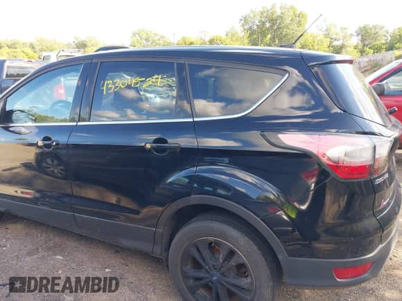 2017 Ford Escape SE with VIN 1FMCU9GD0HUA12356, listed as a IAAI auction lot 43304524 with 104,565 mi miles and . Bid and sale history available at DreamBid. Image 14.