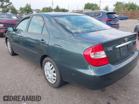 2004 Toyota Camry LE with VIN 4T1BE32K94U339635, listed as a IAAI auction lot 43041101 with 153,448 mi miles and . Bid and sale history available at DreamBid. Image 3.