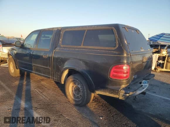 2002 Ford F-150 XLT z VIN 1FTRW07L72KB07852, wystawiony jako Copart lot #87215005 z przebiegiem 234 280 mil mil oraz Czysty tytuł • Clean title. Historia ofert i sprzedaży dostępna na DreamBid. Obrazek 2.