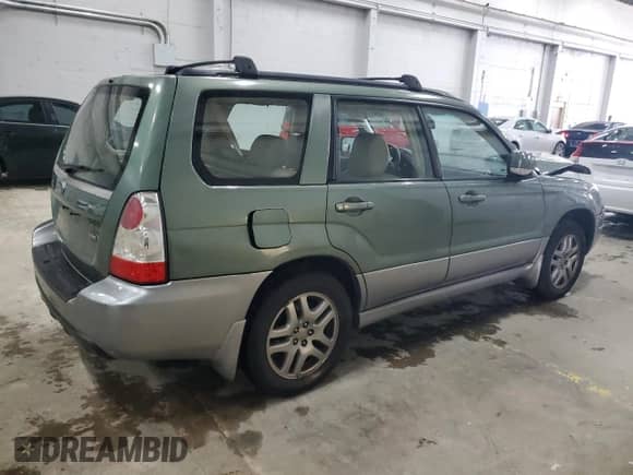 2007 Subaru Forester X L.L. Bean with VIN JF1SG67697H739094, listed as a Copart auction lot 58479625 with 249,539 mi miles and Salvage title. Bid and sale history available at DreamBid. Image 3.
