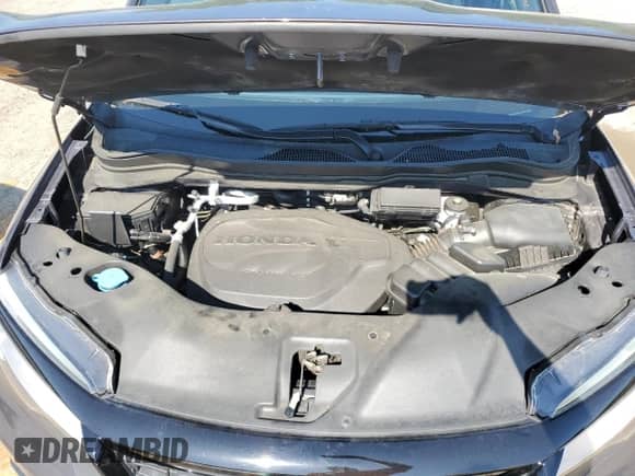 2021 Honda Passport Touring with VIN 5FNYF7H97MB011307, listed as a Copart auction lot 52310415 with 72,118 mi miles and Salvage title. Bid and sale history available at DreamBid. Image 12.