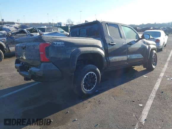 2024 Toyota Tacoma SR5 with VIN 3TMLB5JN3RM028853, listed as a IAAI auction lot 40990601 with 10,095 mi miles and . Bid and sale history available at DreamBid. Image 4.