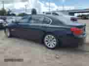 2011 BMW 7 Series with VIN WBAKX8C57BC198326, listed as a Copart auction lot 69985174 with 142,353 mi miles and Clean title. Bid and sale history available at DreamBid. Image 2.