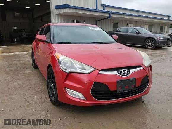 2013 Hyundai Veloster w/Black Int z VIN KMHTC6AD1DU167261, wystawiony jako Copart lot #63744355 z przebiegiem 121 478 mil mil oraz Czysty tytuł • Clean title. Historia ofert i sprzedaży dostępna na DreamBid. Obrazek 13.