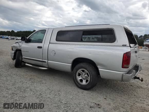 2005 Dodge 1500 ST with VIN 1D7HA16K35J551173, listed as a Copart auction lot 69730475 with 221,914 mi miles and Salvage title. Bid and sale history available at DreamBid. Image 2.