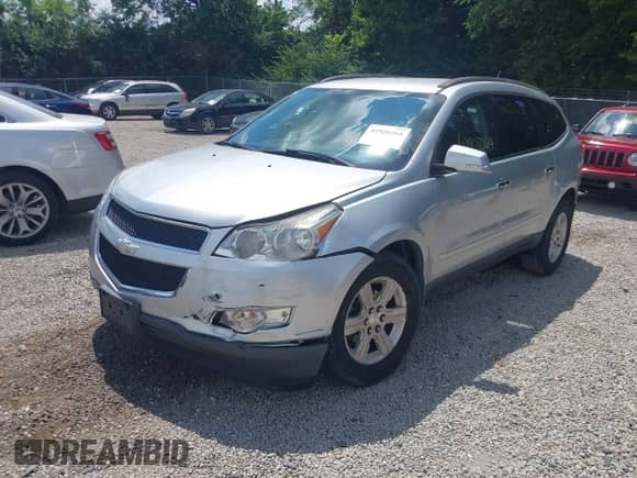 2012 Chevrolet Traverse 1LT with VIN 1GNKRGED2CJ371587, listed as a IAAI auction lot 42928264 with 61,201 mi miles and . Bid and sale history available at DreamBid. Image 2.