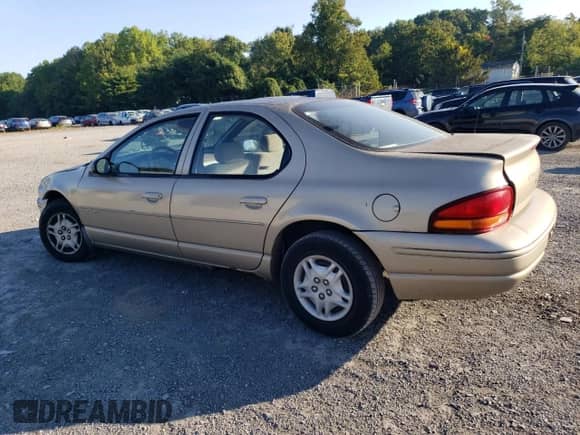 1999 Dodge Stratus with VIN 1B3EJ46X0XN684268, listed as a Copart auction lot 70312664 with 140,711 mi miles and Salvage title. Bid and sale history available at DreamBid. Image 2.