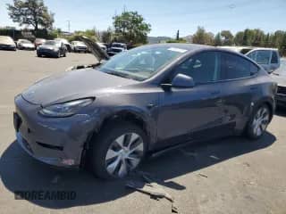 2023 Tesla Model Y with VIN 7SAYGDED4PF979800, listed as a Copart auction lot 69680005 with 14,607 mi miles and Salvage title. Bid and sale history available at DreamBid. Image 1.