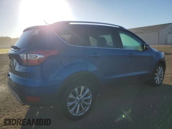 2017 Ford Escape Titanium с VIN 1FMCU9J96HUA10292, выставлен на аукционе Copart как лот 86331325 с пробегом 143 759 миль миль и Чистый • Clean title. История ставок и продаж доступна на DreamBid. Изображение 3.